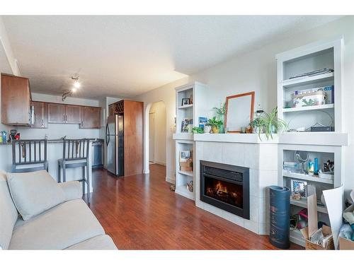 16-2104 17 Street Sw, Calgary, AB - Indoor Photo Showing Living Room With Fireplace