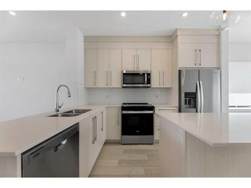 1305-280 Chelsea Road, Chestermere, AB - Indoor Photo Showing Kitchen With Stainless Steel Kitchen With Double Sink With Upgraded Kitchen