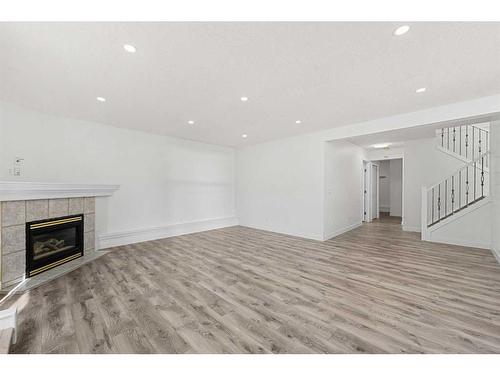 60 Panorama Hills Place Nw, Calgary, AB - Indoor Photo Showing Living Room With Fireplace