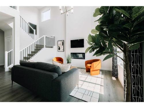 35 Saddlebred Place, Cochrane, AB - Indoor Photo Showing Living Room With Fireplace