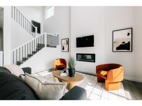 35 Saddlebred Place, Cochrane, AB - Indoor Photo Showing Living Room With Fireplace