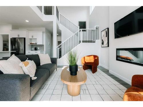 35 Saddlebred Place, Cochrane, AB - Indoor Photo Showing Living Room With Fireplace