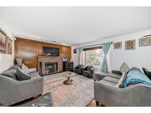 2538 Catalina Boulevard Ne, Calgary, AB - Indoor Photo Showing Living Room With Fireplace