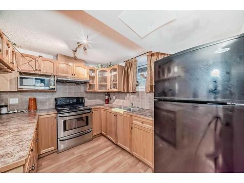 2538 Catalina Boulevard Ne, Calgary, AB - Indoor Photo Showing Kitchen With Double Sink