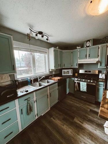 207 9 Avenue Ne, Sundre, AB - Indoor Photo Showing Kitchen With Double Sink