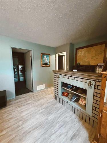 207 9 Avenue Ne, Sundre, AB - Indoor With Fireplace