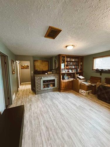 207 9 Avenue Ne, Sundre, AB - Indoor With Fireplace