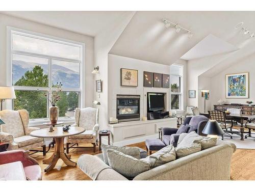 149 Carey, Canmore, AB - Indoor Photo Showing Living Room With Fireplace