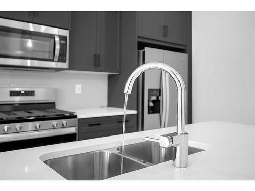 103 Amblefield Avenue Nw, Calgary, AB - Indoor Photo Showing Kitchen With Double Sink With Upgraded Kitchen