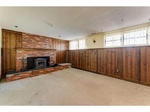 461 Lake Ontario Place Se, Calgary, AB - Indoor Photo Showing Living Room With Fireplace