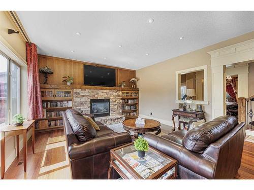 2593 Coopers Circle Sw, Airdrie, AB - Indoor Photo Showing Living Room With Fireplace