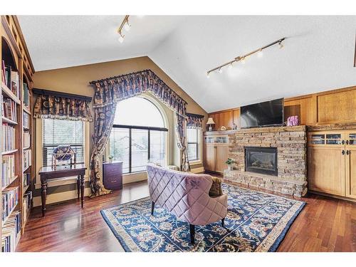 2593 Coopers Circle Sw, Airdrie, AB - Indoor Photo Showing Living Room With Fireplace