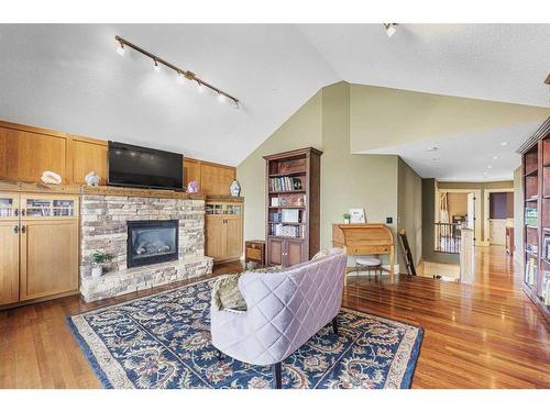 2593 Coopers Circle Sw, Airdrie, AB - Indoor Photo Showing Living Room With Fireplace