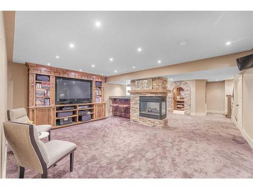 2593 Coopers Circle Sw, Airdrie, AB - Indoor With Fireplace