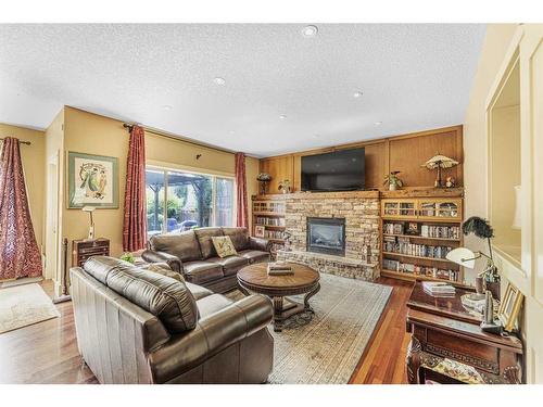 2593 Coopers Circle Sw, Airdrie, AB - Indoor Photo Showing Living Room With Fireplace