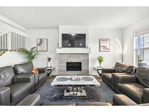 20 Copperhead Place Se, Calgary, AB - Indoor Photo Showing Living Room With Fireplace