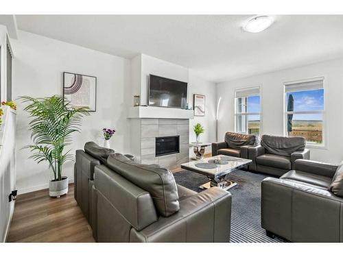 20 Copperhead Place Se, Calgary, AB - Indoor Photo Showing Living Room With Fireplace