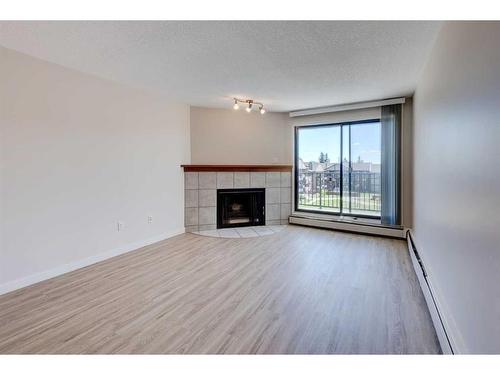 3310-13045 6 Street Sw, Calgary, AB - Indoor Photo Showing Living Room With Fireplace