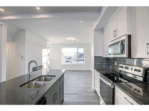 341 Waterford Boulevard, Chestermere, AB - Indoor Photo Showing Kitchen With Double Sink With Upgraded Kitchen