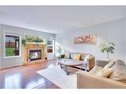 319 Springborough Way Sw, Calgary, AB - Indoor Photo Showing Living Room With Fireplace