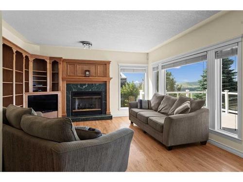 55 Schiller Crescent Nw, Calgary, AB - Indoor Photo Showing Living Room With Fireplace