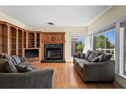 55 Schiller Crescent Nw, Calgary, AB - Indoor Photo Showing Living Room With Fireplace