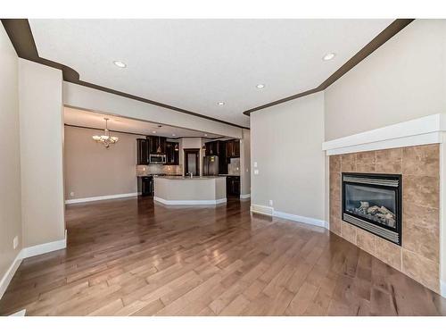 1214 Kingston Crescent Se, Airdrie, AB - Indoor Photo Showing Living Room With Fireplace