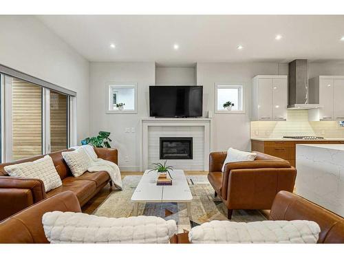 4627 21 Avenue Nw, Calgary, AB - Indoor Photo Showing Living Room With Fireplace