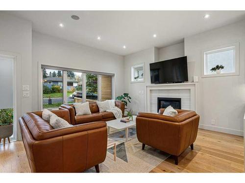 4627 21 Avenue Nw, Calgary, AB - Indoor Photo Showing Living Room With Fireplace