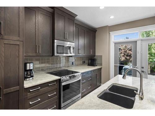 161 Aspenshire Crescent Sw, Calgary, AB - Indoor Photo Showing Kitchen With Double Sink With Upgraded Kitchen