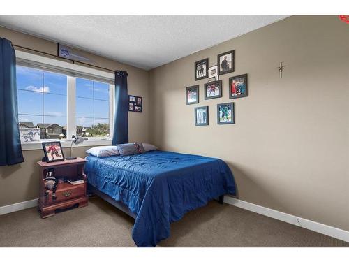 161 Aspenshire Crescent Sw, Calgary, AB - Indoor Photo Showing Bedroom