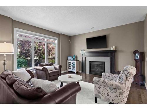 161 Aspenshire Crescent Sw, Calgary, AB - Indoor Photo Showing Living Room With Fireplace