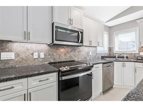 336 Willow Ridge Manor, Diamond Valley, AB - Indoor Photo Showing Kitchen With Stainless Steel Kitchen With Double Sink With Upgraded Kitchen