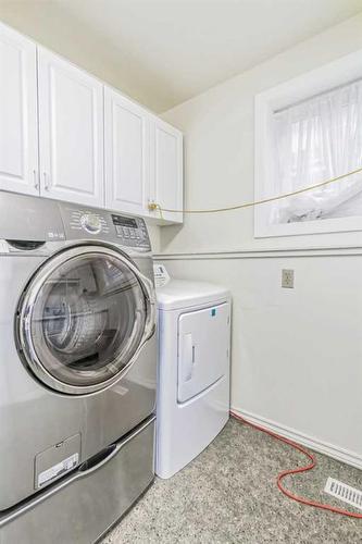 2820 Morley Trail Nw, Calgary, AB - Indoor Photo Showing Laundry Room