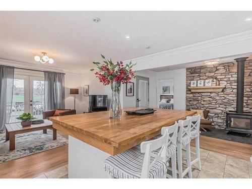 2820 Morley Trail Nw, Calgary, AB - Indoor Photo Showing Dining Room With Fireplace