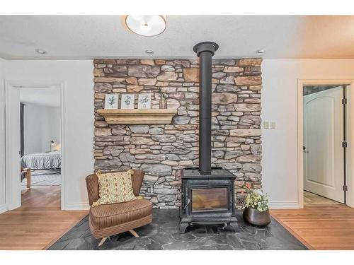 2820 Morley Trail Nw, Calgary, AB - Indoor Photo Showing Living Room With Fireplace