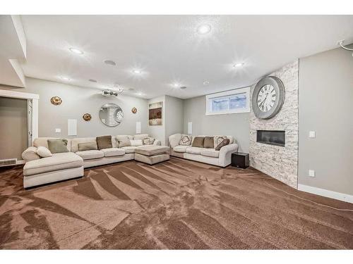 156 Auburn Sound Manor Se, Calgary, AB - Indoor Photo Showing Living Room With Fireplace