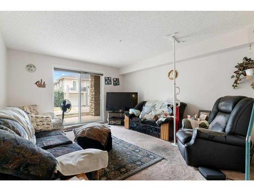 2102-2600 66 Street Ne, Calgary, AB - Indoor Photo Showing Living Room