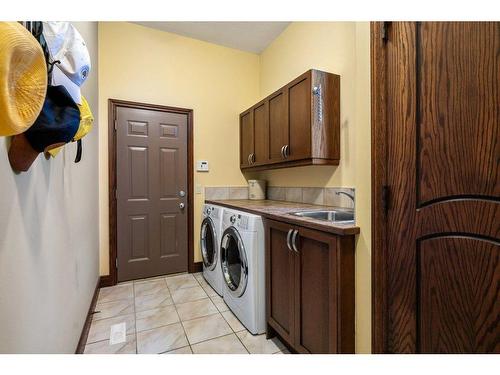 64 Heritage Lake Drive, Heritage Pointe, AB - Indoor Photo Showing Laundry Room