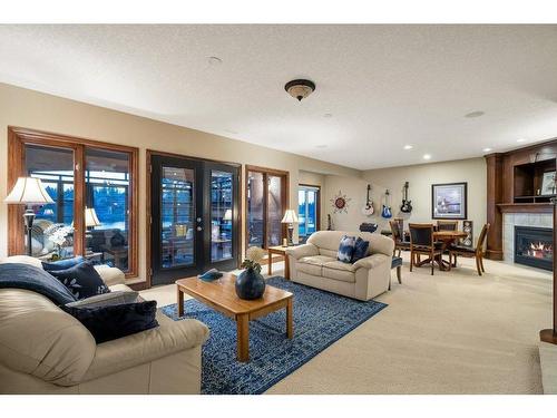 64 Heritage Lake Drive, Heritage Pointe, AB - Indoor Photo Showing Living Room With Fireplace