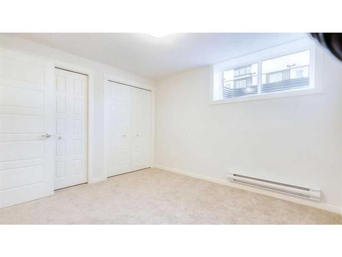 211-474 Seton Circle Se, Calgary, AB - Indoor Photo Showing Other Room