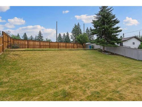 244 Queensland Road Se, Calgary, AB - Outdoor With Backyard