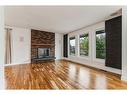 244 Queensland Road Se, Calgary, AB  - Indoor Photo Showing Living Room With Fireplace 