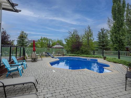 8990 9 Avenue Sw, Calgary, AB - Outdoor With In Ground Pool With Deck Patio Veranda With Backyard