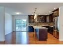 27 Meadowview Road Sw, Calgary, AB  - Indoor Photo Showing Kitchen With Double Sink With Upgraded Kitchen 