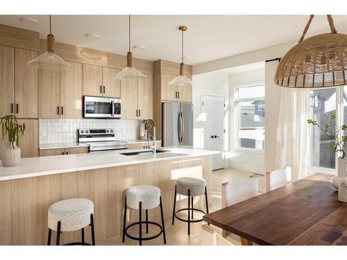 57 Shale Avenue, Cochrane, AB - Indoor Photo Showing Kitchen With Upgraded Kitchen