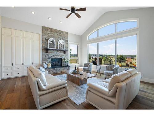 240 Brown Bear Point, Rural Rocky View County, AB - Indoor Photo Showing Living Room With Fireplace