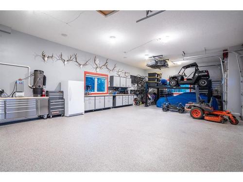 240 Brown Bear Point, Rural Rocky View County, AB - Indoor Photo Showing Garage