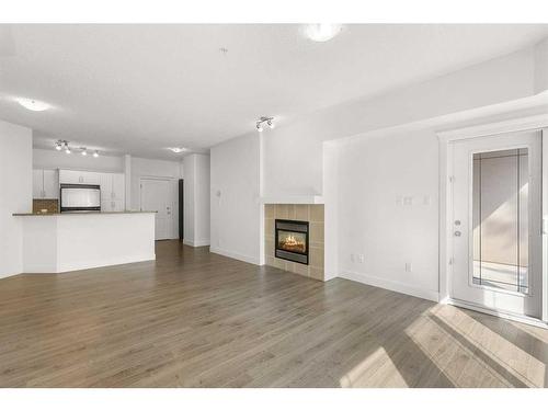 319-10 Discovery Ridge Close Sw, Calgary, AB - Indoor With Fireplace