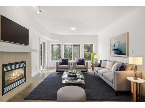 319-10 Discovery Ridge Close Sw, Calgary, AB - Indoor Photo Showing Living Room With Fireplace